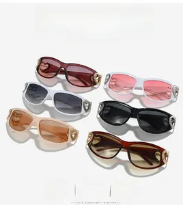 Detailed close-up of six trendy Y2K heart-accent sunglasses in various chic frame colors