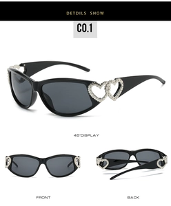 Detail of black Y2K sunglasses featuring silver hollow heart decorations on the temples