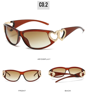 Detail view of heart-shaped gold temple cut-outs on Y2K cat eye sunglasses