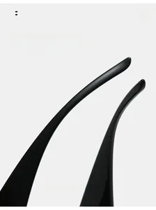 Detail view of glossy black Y2K sunglasses with curved temples for comfortable wear