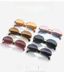 Six colors of rimless octagonal sunglasses with faceted edges and gold metal frames