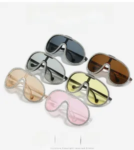 Detail view of oversized pilot sunglasses with rhinestone frames in multiple colors