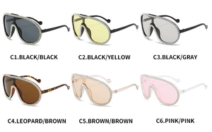Detailed view of oversized aviator sunglasses set with double-row rhinestone crystal edges
