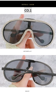 Detail view of oversized aviator sunglasses with luxury rhinestone encrusted frame