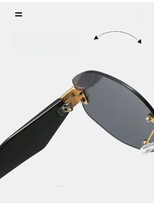 Close-up of durable metal hinge on rimless sunglasses with gradient grey lenses
