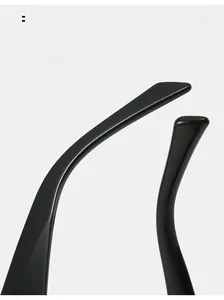 Macro detail of ergonomic curved black temple tips on rimless sunglasses for comfort