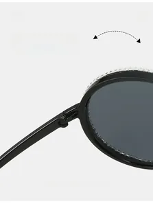 Detail of durable texture hinge and rhinestone inlay on oversized aviator sunglasses