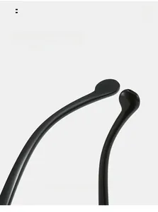 Detail of curved black sunglasses legs showing ergonomic arc for comfortable wear