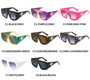 Detail view of oversized square sunglasses in eight colors with golden ring temple accents