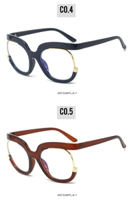 Détails de lunettes demi-cerclées bleues et ambre avec accents en métal doré et monture épaisse