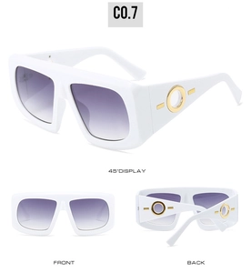 Detailed view of white oversized sunglasses with gold metal ring temple and purple gradient lenses