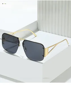 Detail of gold metal temples with hollow triangle geometric design on square sunglasses