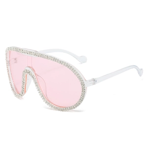 Oversized pink wrap-around pilot sunglasses with sparkling rhinestone-studded frames