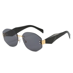 Fashion rimless oversized polygon sunglasses with grey lenses and gold metal accents