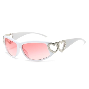 Y2K style white frame sunglasses with pink gradient lenses and silver heart detail