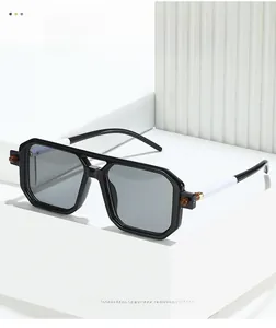 Detail of square black sunglasses featuring unique two-tone temples and hinge accents