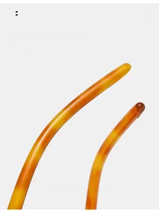 Detail of curved amber tortoiseshell temples for maximum comfort on square sunglasses