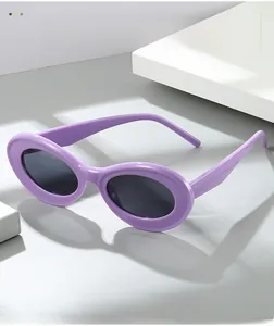 Detailed side view of purple oval vintage sunglasses with thick frames and grey lenses