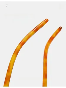 Macro detail of tortoiseshell glasses temples featuring anti-slip texture and curved design