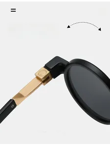 Detailed close-up of durable gold metal hinges on retro oversized round frame sunglasses