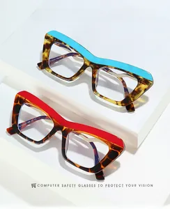 Close-up of stylish cat-eye anti-blue light glasses in blue and red tortoiseshell frames