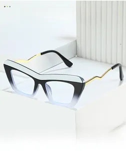 Detail of cat-eye glasses frame featuring black-white splicing and golden wavy metal temples