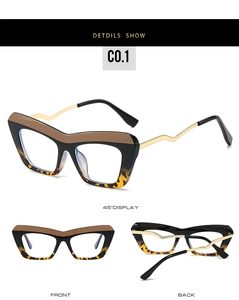 Macro detail of cat-eye eyewear showing leopard print frames and golden wavy metal temples