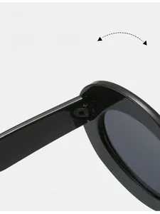 Detailed close-up of durable reinforced hinges on black vintage oval cat-eye sunglasses