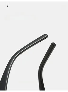 Detailed close-up of curved glossy black sunglasses temples with elegant 03 S/S styling