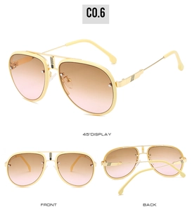 Vue détaillée des lunettes de soleil pilote crème avec verres dégradés et accents dorés
