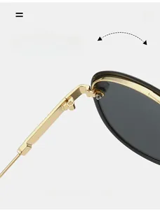 Vue macro des charnières en métal doré sur lunettes d'aviateur rétro à double pont