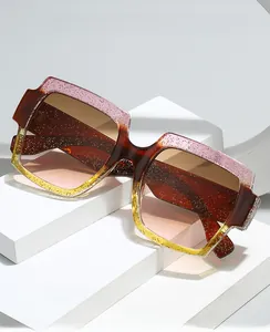 Detail of square gradient frame glasses with sparkling glitter on white geometric steps