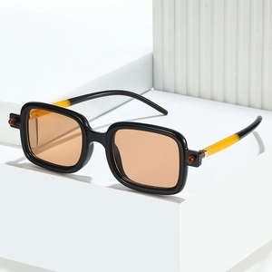 Retro square oversized sunglasses with amber lenses and two-tone temples on a white pedestal