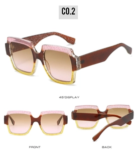 Detail view of square gradient pink and yellow sunglasses with glitter texture frames