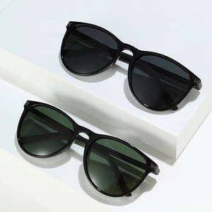 Retro polarized cat eye sunglasses with thick black frames and colorful lenses in a pair