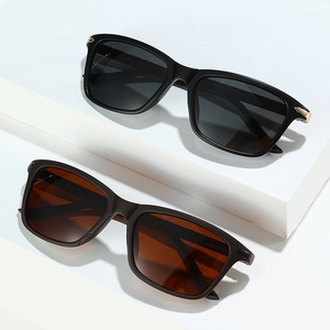 Men's polarized square sunglasses with black and brown frames on white podium