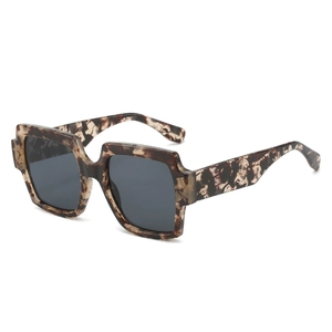 Chic oversized square sunglasses featuring dark tortoise frames and grey lenses