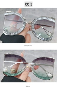 Detail view of square rhinestone sunglasses with gradient lenses and pearl temple tips