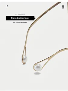 Detail of curved golden metal temples with elegant white pearl inlay and hollow design