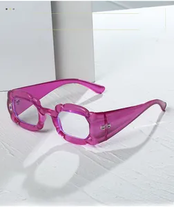 Detail view of purple translucent square frame glasses with jelly texture and metal hinges