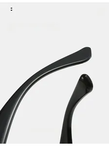 Detail of curved black mirror legs on fashion glasses for ergonomic and secure fitting