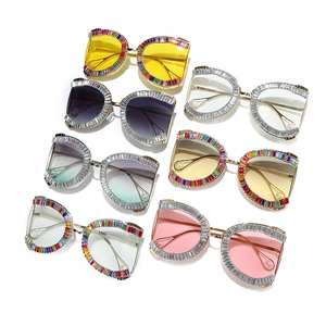 Irregular oversized sunglasses with rhinestone frames and pearl tips in multiple colors