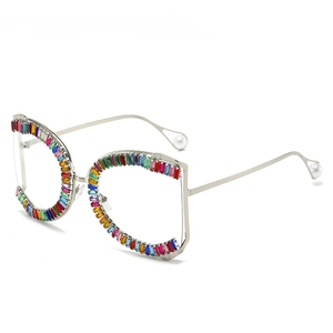 Oversized irregular sunglasses with multicolor baguette crystals and pearl temple tips