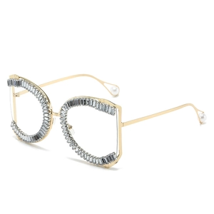 Oversized irregular rhinestone sunglasses with gold temples and pearl accents