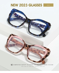 Detailed shot of cat-eye TR90 frames in blue marble and pink leopard textures