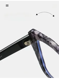 Macro shot of durable silver metal hinges on marbled black TR90 optical glasses