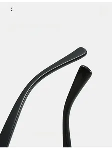 Close-up of curved TR90 glasses legs showing glossy black ergonomic design detail