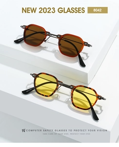 Macro view of vintage small frame sunglasses featuring tortoise patterns and sturdy metal hinges