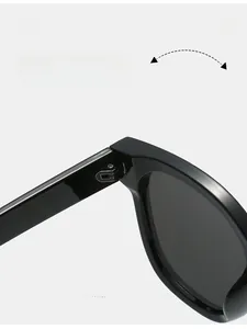 Close-up of durable metal hinge on retro oval sunglasses for smooth folding