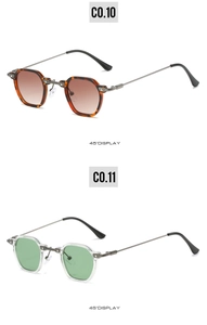 Detail view of tortoiseshell and transparent hexagonal sunglasses with metal temples
